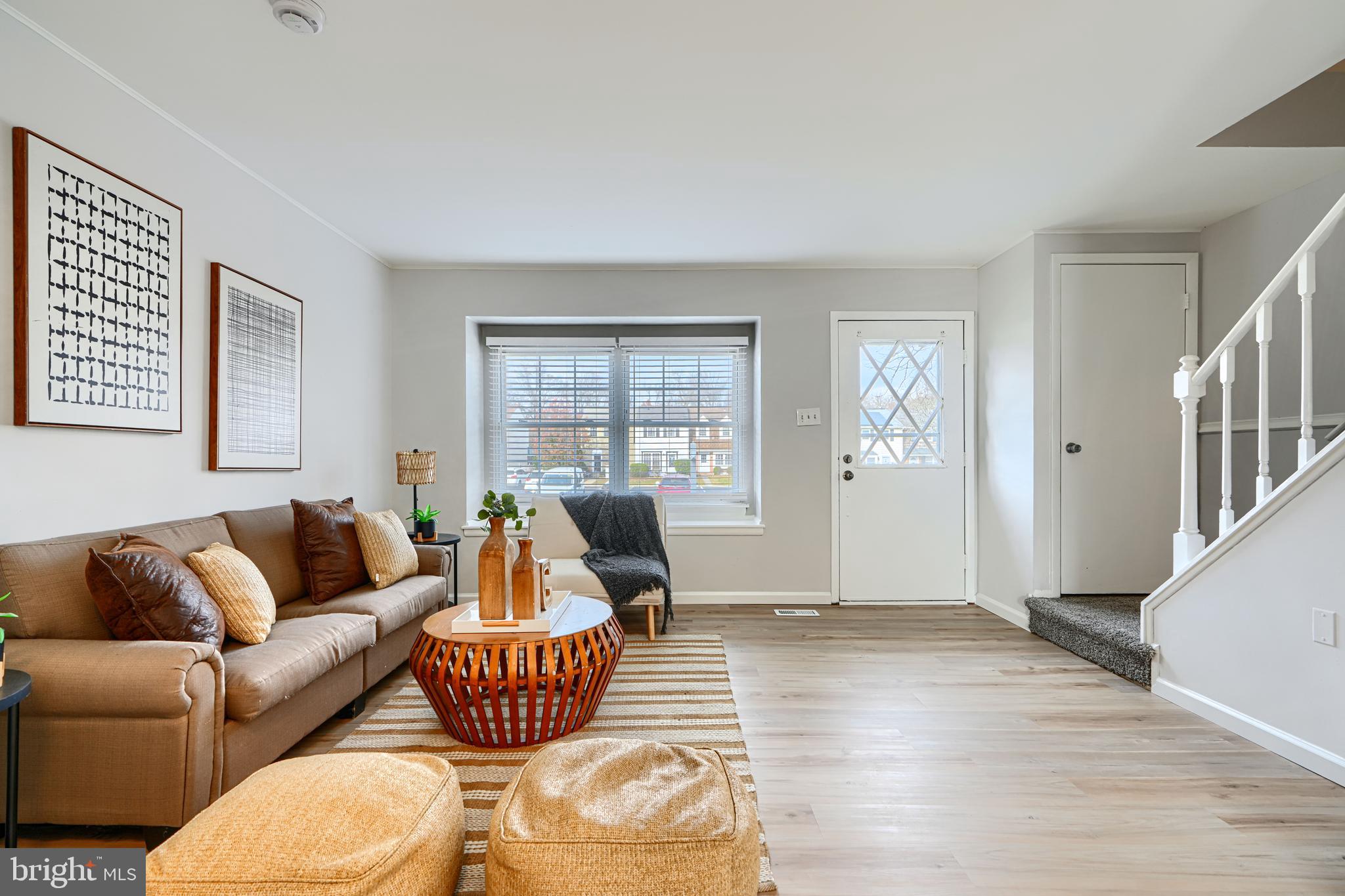 8 King Richard Court, Unit 8 Rosedale, MD 21237 - Photo 4 of 41 a living room with furniture wooden floor and a window