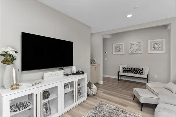a reading room with furniture and a flat screen tv