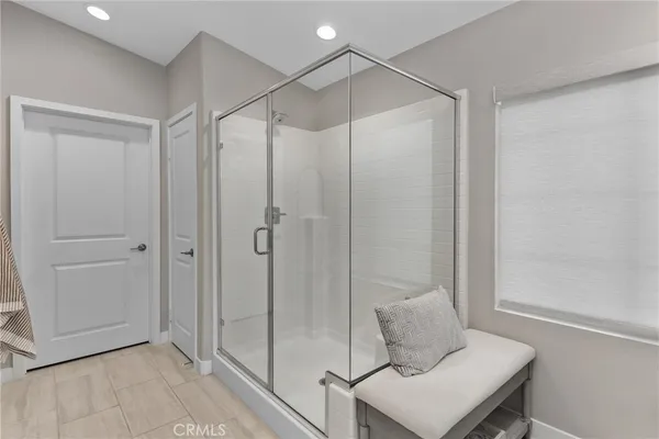 a bathroom with a shower and a sink