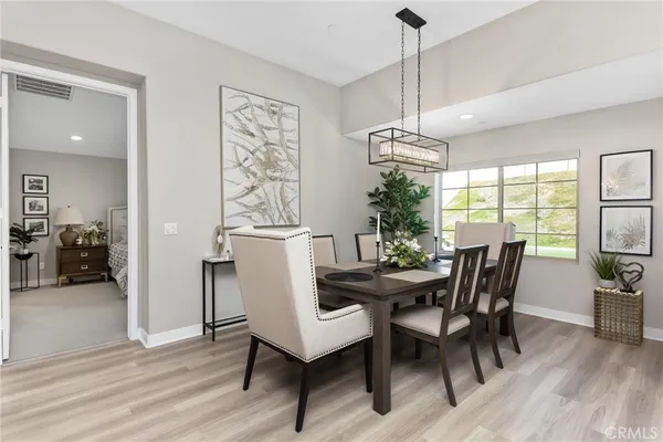 a dining room with furniture window wooden floor