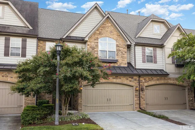 a front view of a house with a garage