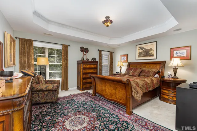 a bedroom with furniture and a window