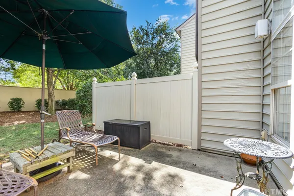 a view of an outdoor sitting area with furniture and backyard