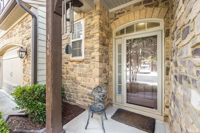 a view of door with brick walls