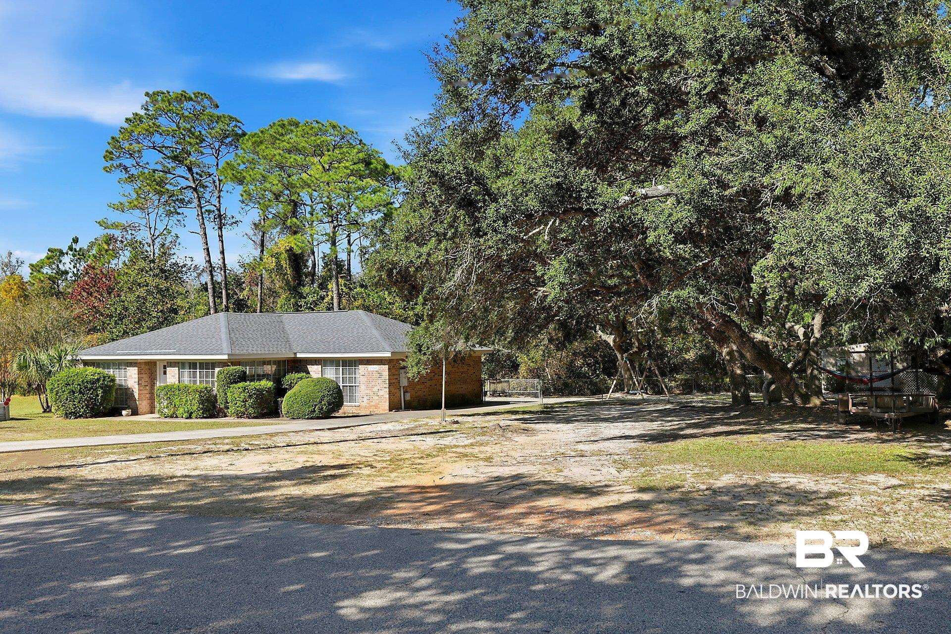 25793 Bonito Avenue Orange Beach, AL 36561 - Photo 3 of 27 Front elevation of the house and adjoining lot