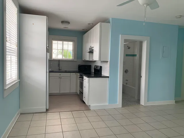 a bathroom with a sink a toilet and a bathtub