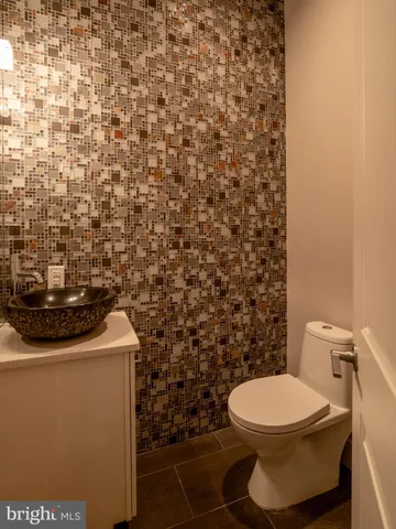 a bathroom with a toilet and a sink