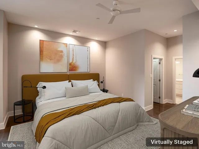 a bedroom with a large bed and a couch