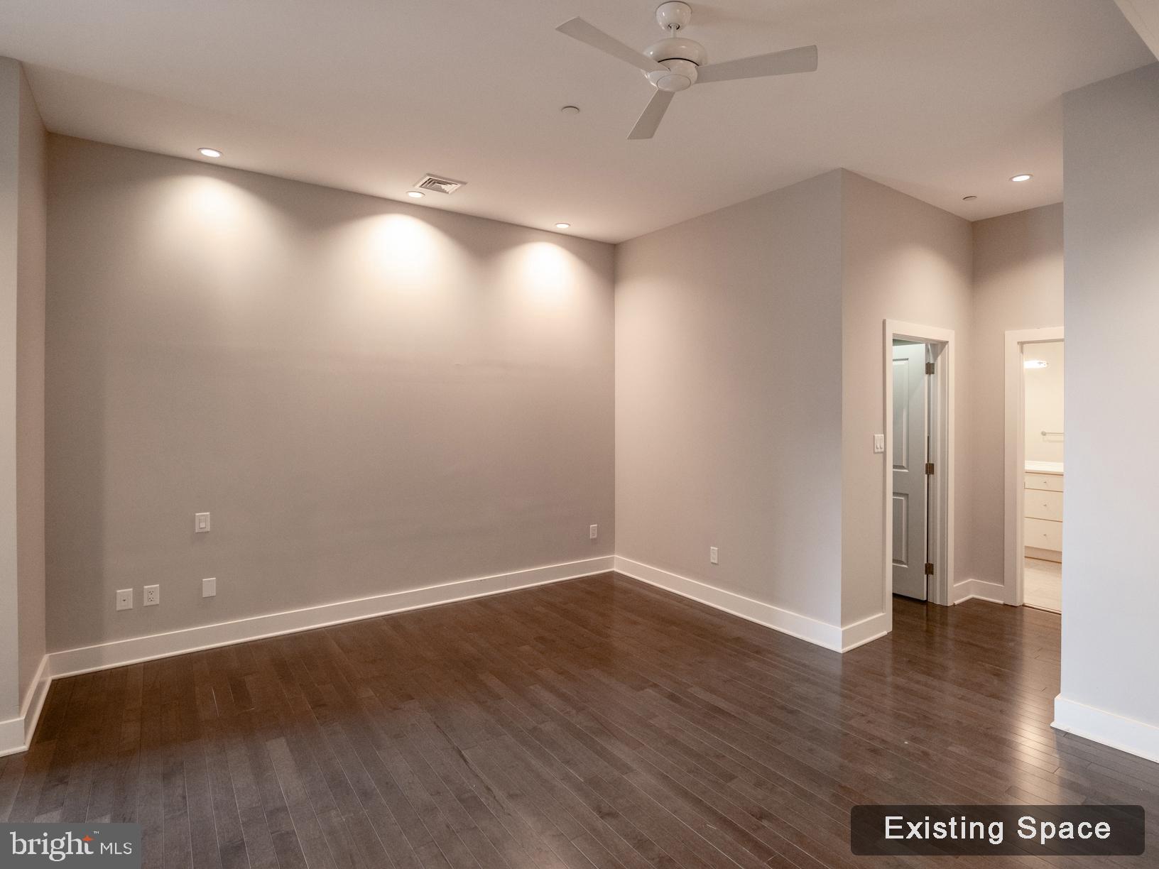 20 Letitia Street, Unit 3B Philadelphia, PA 19106 - Photo 13 of 35 an empty room with wooden floor and windows