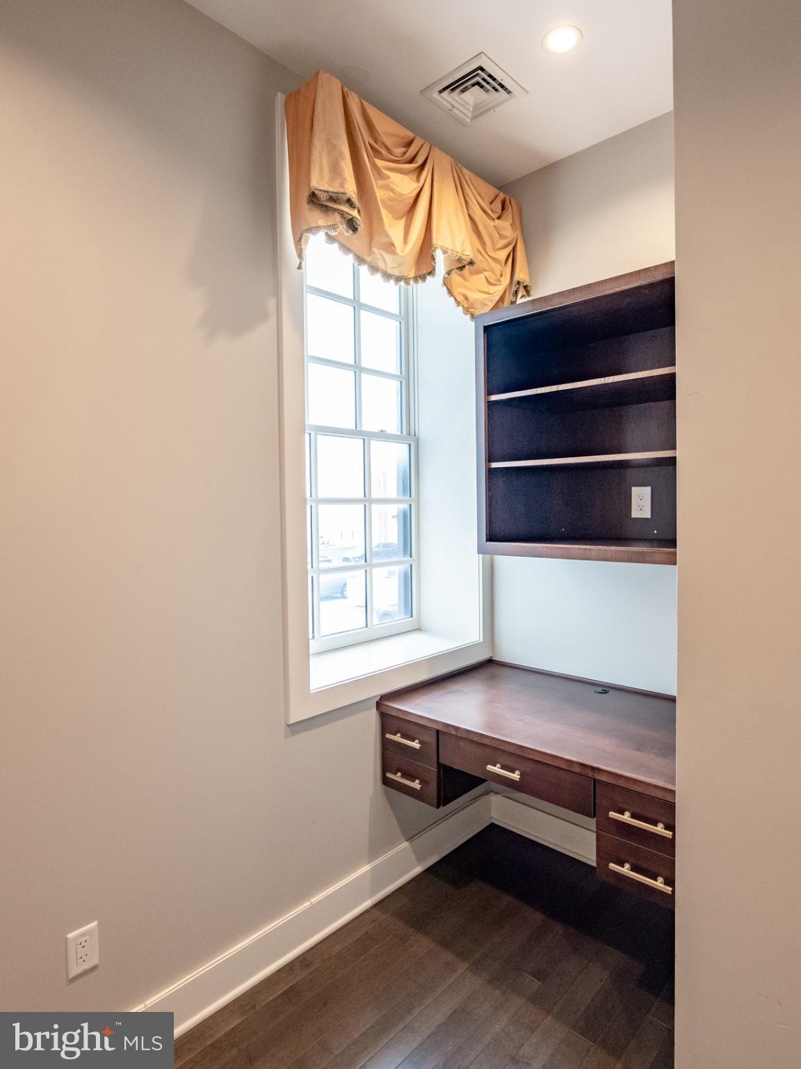 20 Letitia Street, Unit 3B Philadelphia, PA 19106 - Photo 14 of 35 a room with a wooden floor and a window
