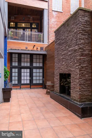 a backyard of a house with dishwasher and outdoor seating