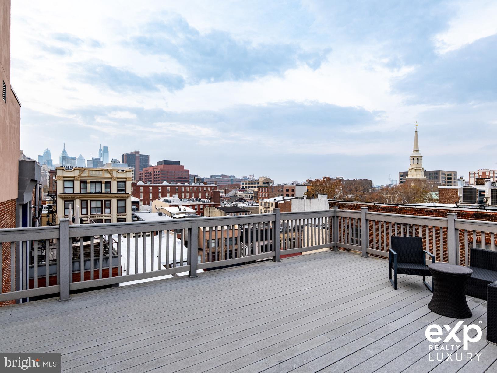 20 Letitia Street, Unit 3B Philadelphia, PA 19106 - Photo 29 of 35 a view of a balcony with wooden benches