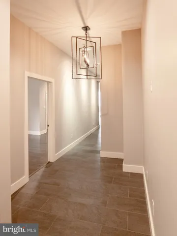 a view of a hallway to an empty room