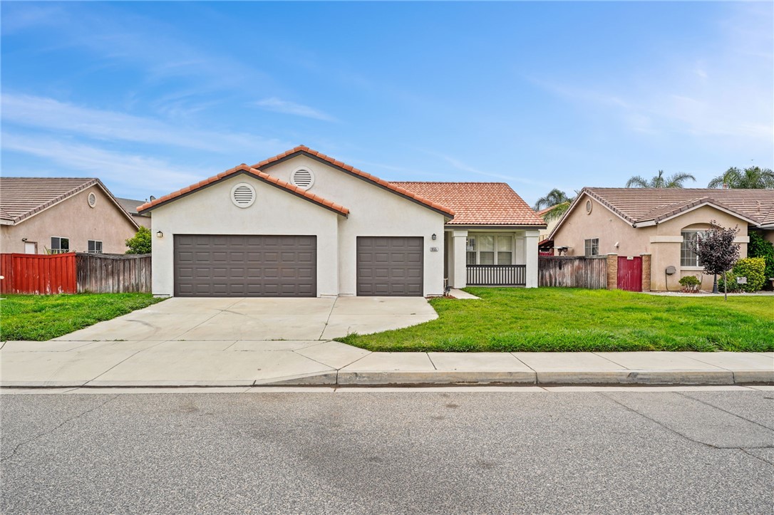 front view of a house with a yard