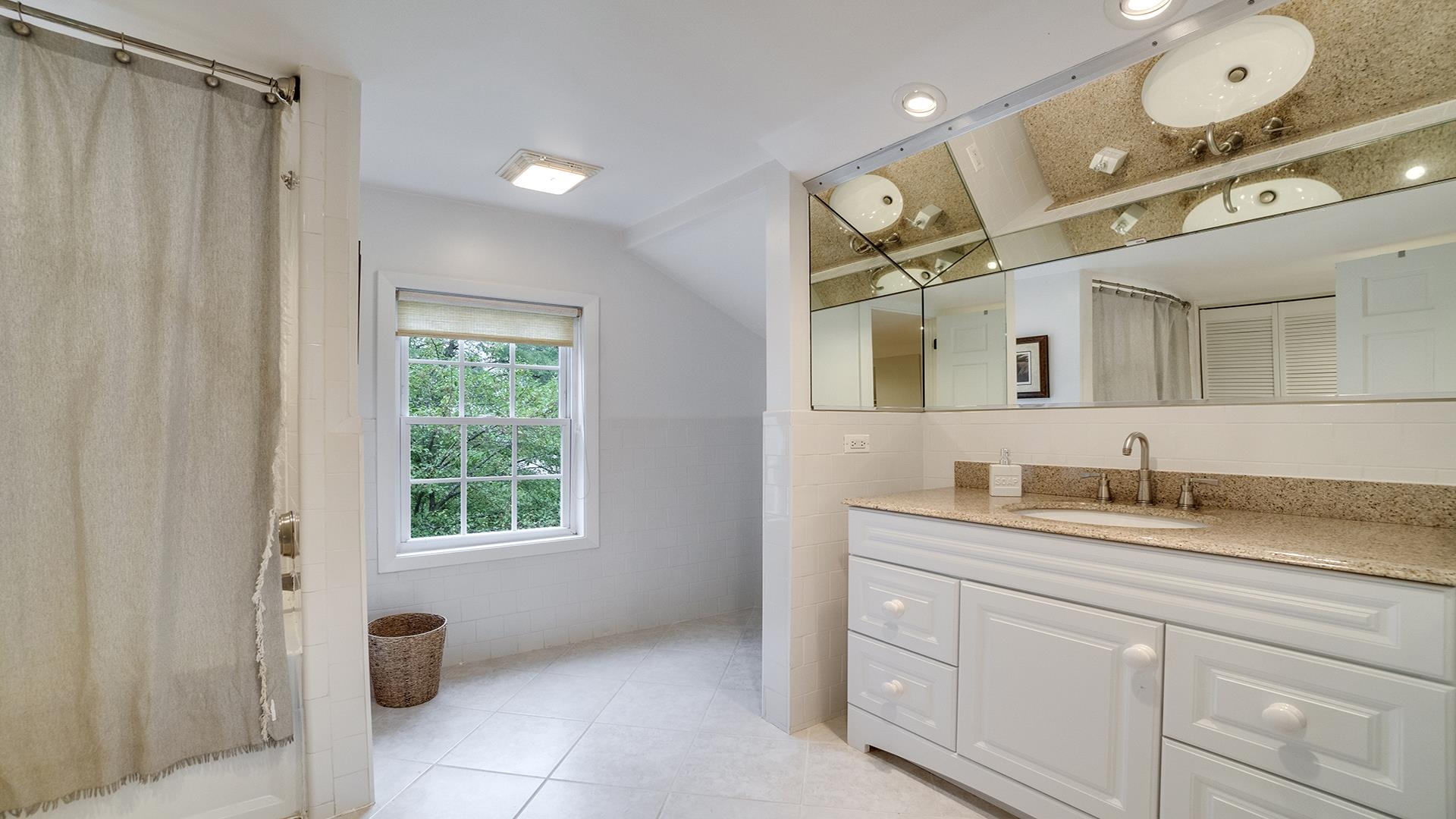 18752 West Edwards Road Antioch, IL 60002 - Photo 58 of 59 a bathroom with a granite countertop sink mirror and a