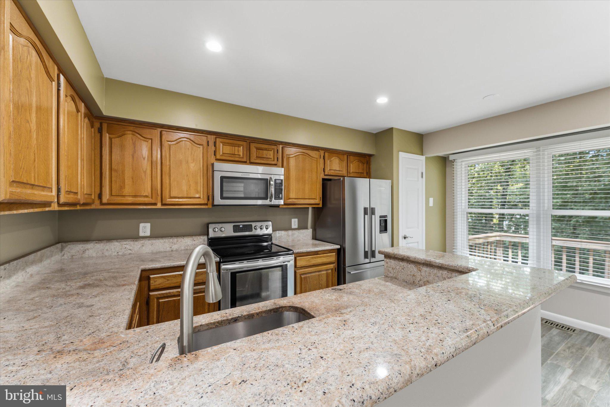 1431 Newport Springs Reston, VA 20194 - Photo 8 of 33 Stainless Steel appliances and granite counter