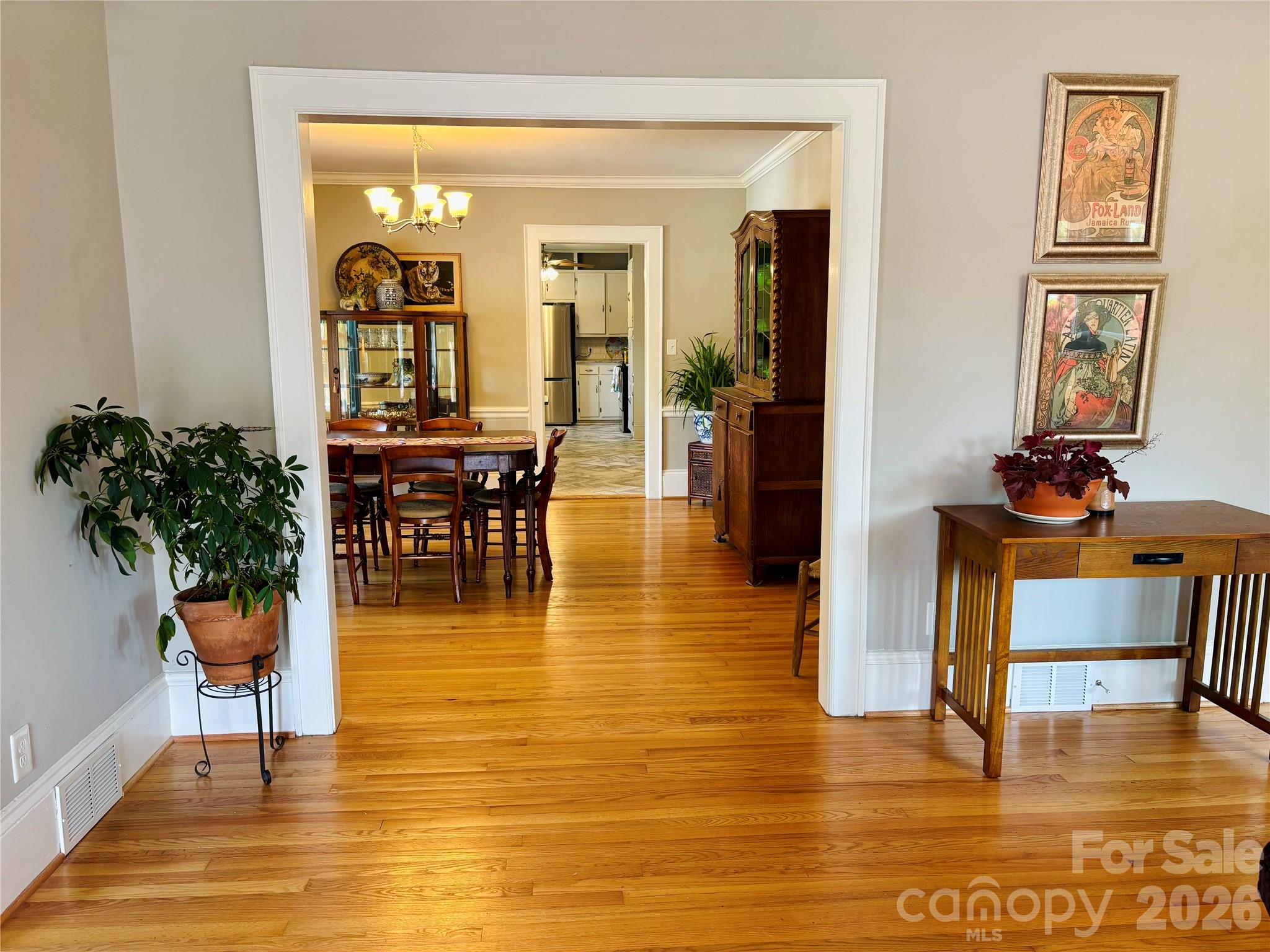 610 East Main Street Cherryville, NC 28021 - Photo 13 of 48 a dining room with chandelier and wooden floor