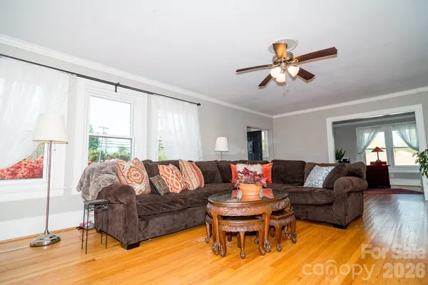 a view of a dining room with furniture and wooden floor