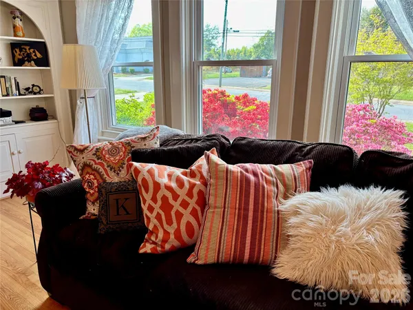 a bedroom with bed and window