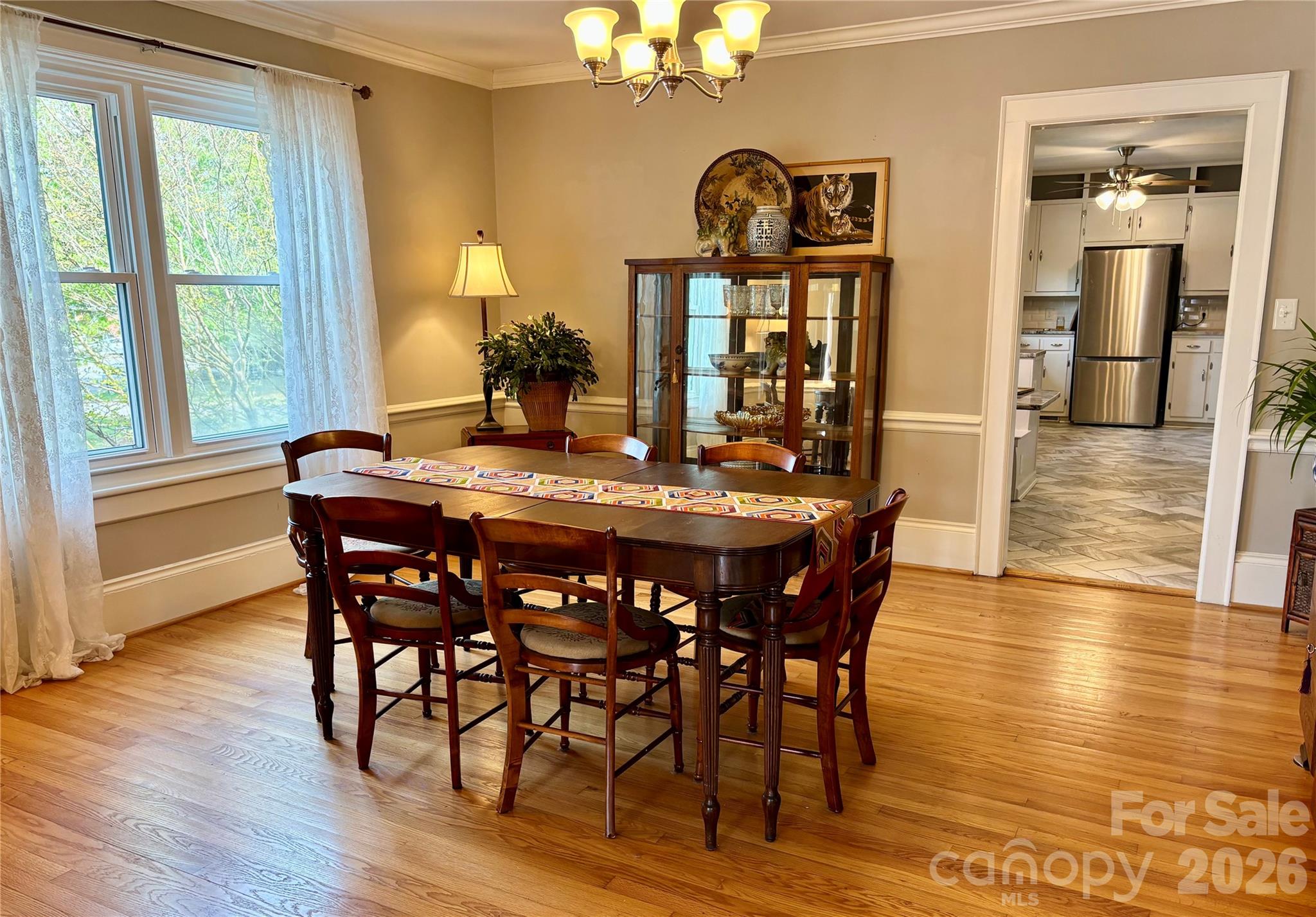 610 East Main Street Cherryville, NC 28021 - Photo 21 of 48 a dining room with furniture wooden floor a chandelier and a painting