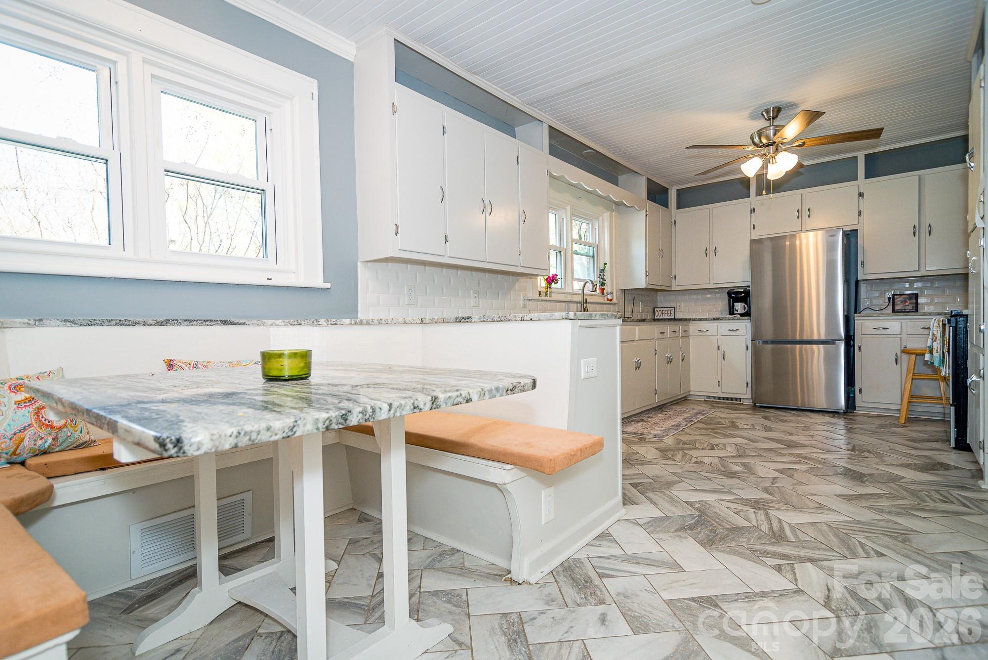 610 East Main Street Cherryville, NC 28021 - Photo 28 of 48 a kitchen with stainless steel appliances granite countertop a stove refrigerator sink and cabinets