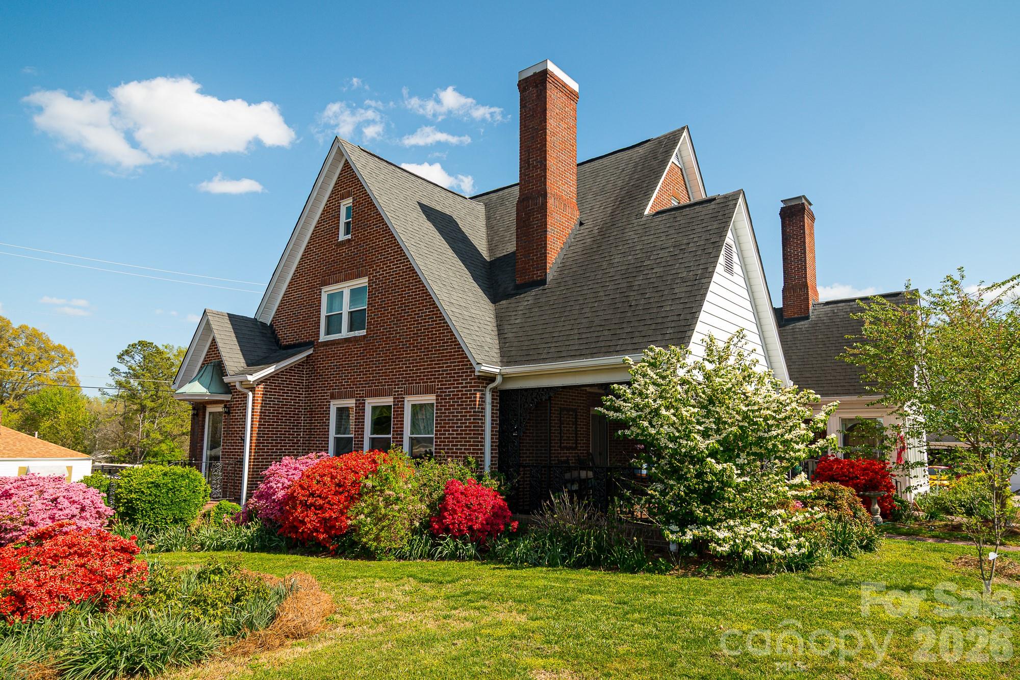 610 East Main Street Cherryville, NC 28021 - Photo 3 of 48 a front view of a house with a big yard and potted plants