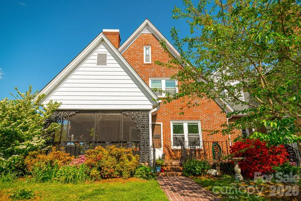 a dining room with furniture and a window