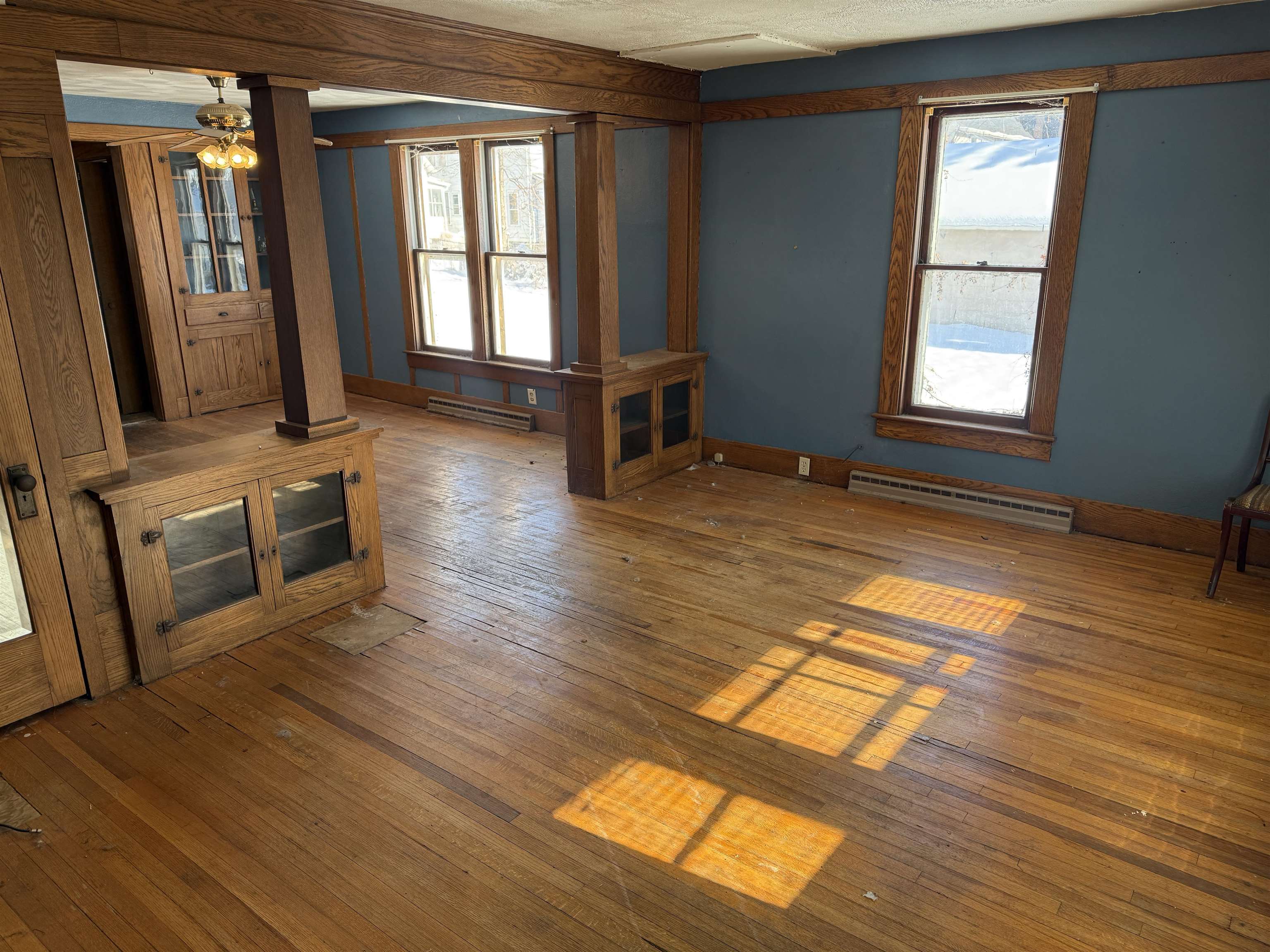 816 West Pleasant Street Freeport, IL 61032 - Photo 2 of 13 wooden floor in an empty room with a window