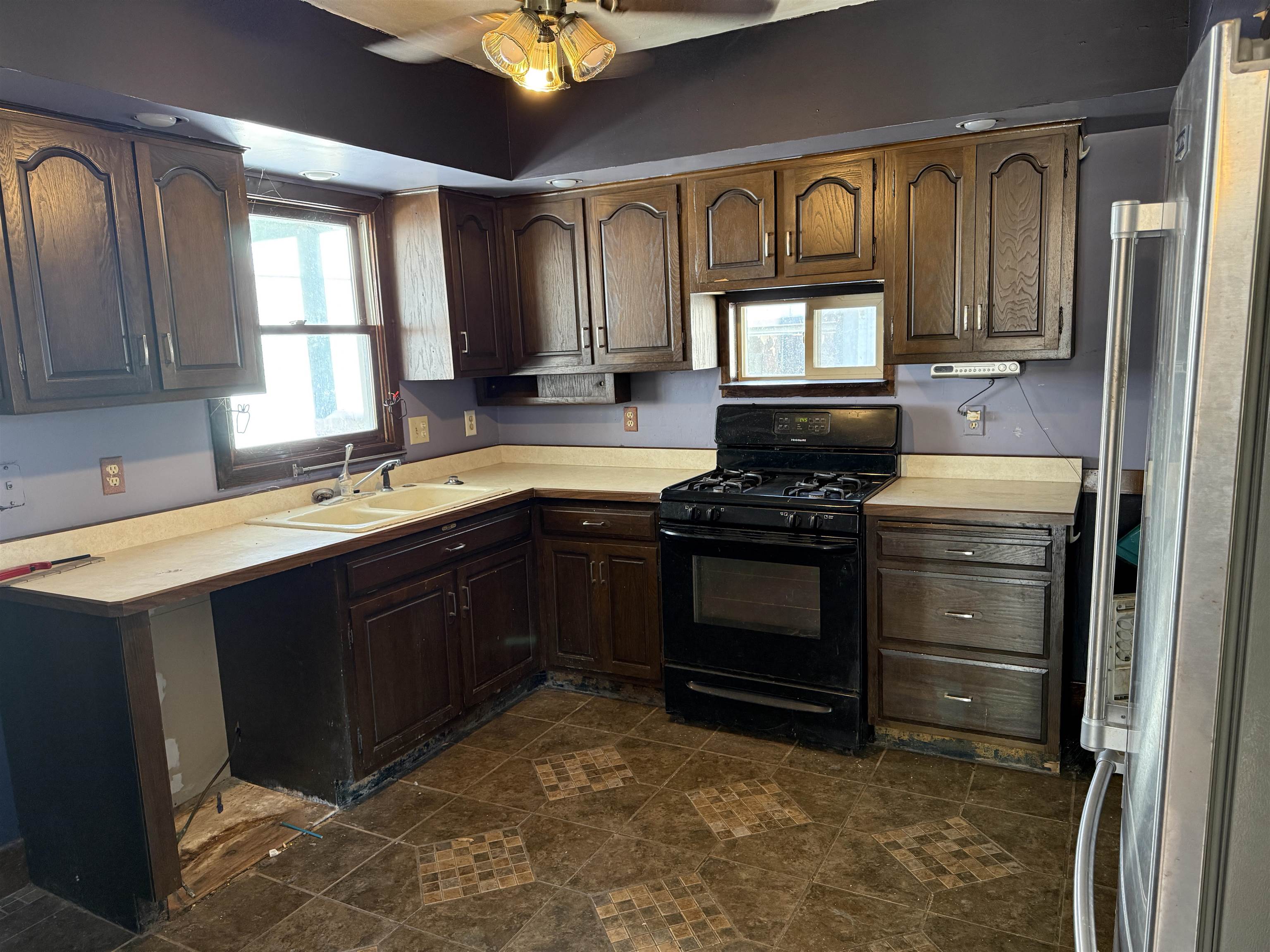 816 West Pleasant Street Freeport, IL 61032 - Photo 5 of 13 a kitchen with stainless steel appliances granite countertop a stove a sink and a microwave
