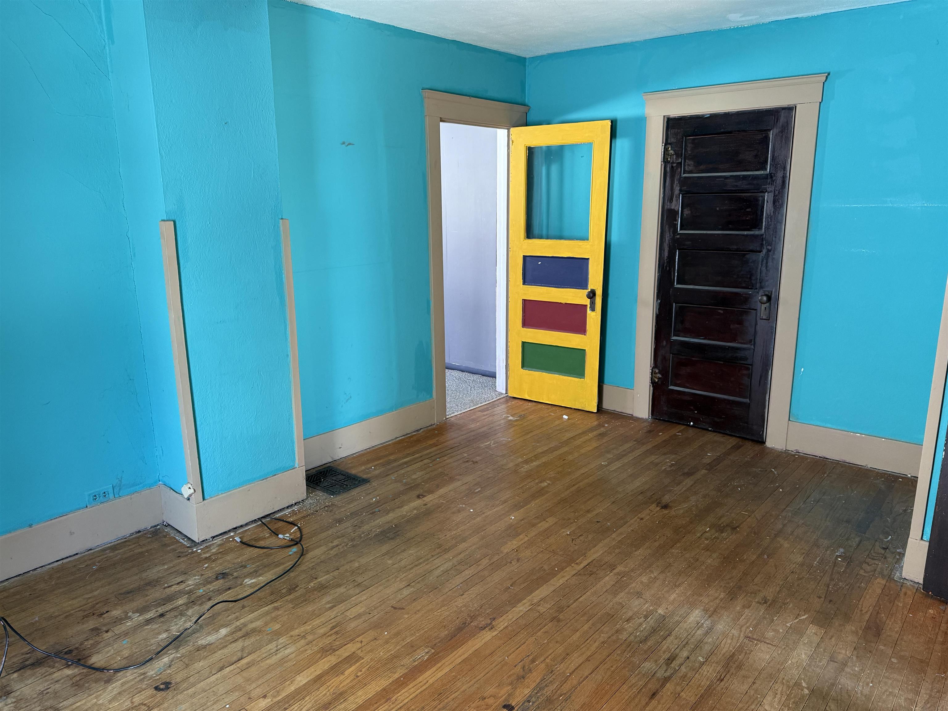 816 West Pleasant Street Freeport, IL 61032 - Photo 8 of 13 a view of empty room with wooden floor and closet