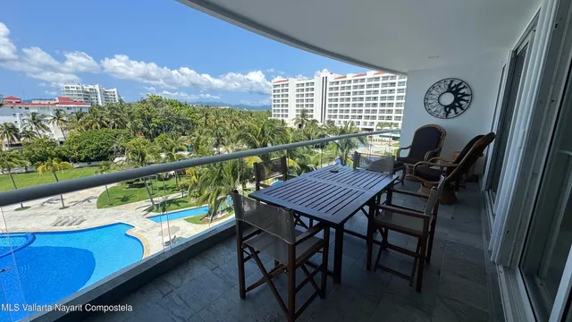 a view of a balcony with furniture