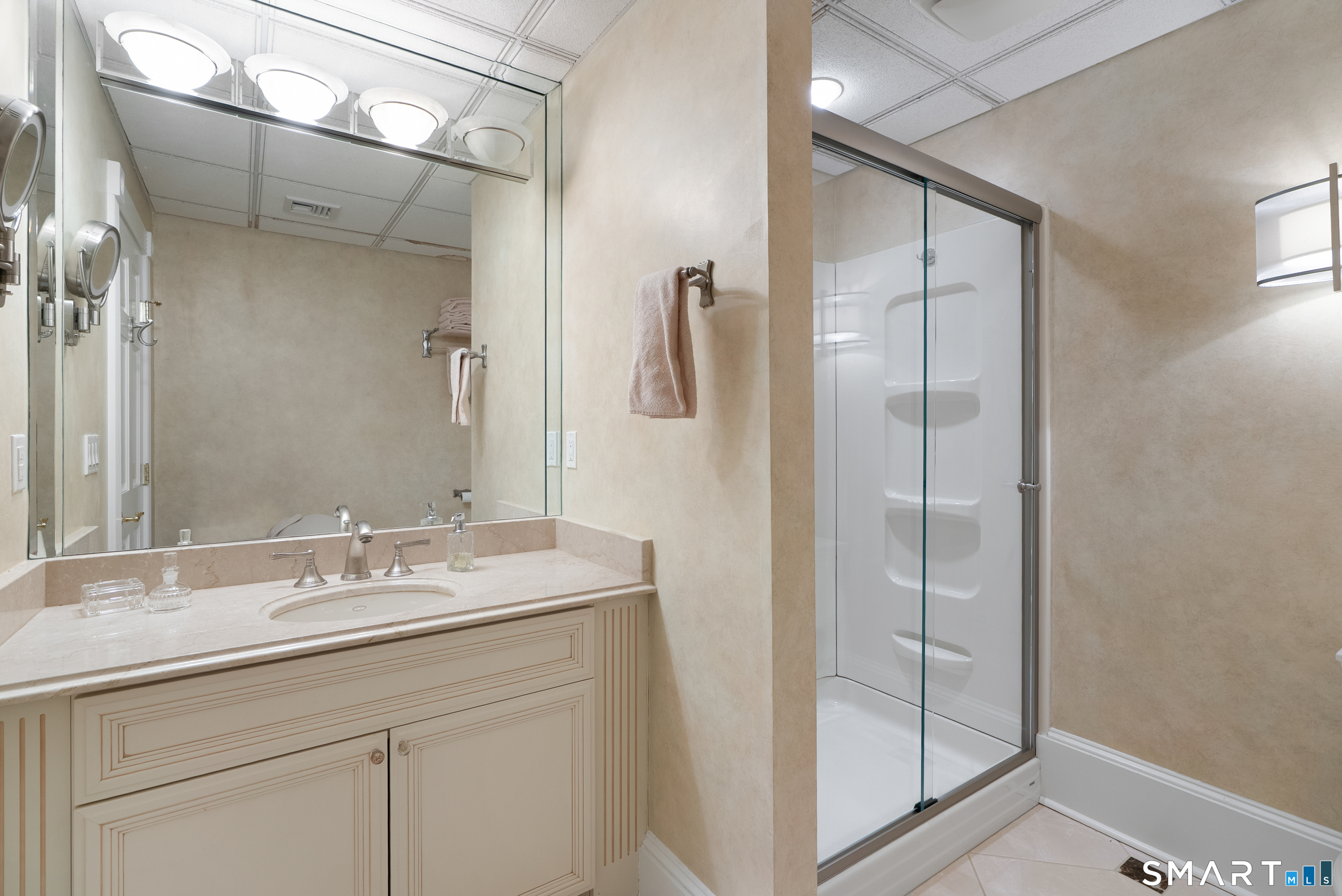 57 Thistledown Suffield, CT 06078 - Photo 29 of 39 a bathroom with a shower sink and mirror