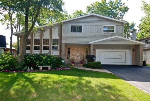 1792 McCraren Road Highland Park, IL 60035 - Photo 1 of 1 a front view of a house with a yard and garage