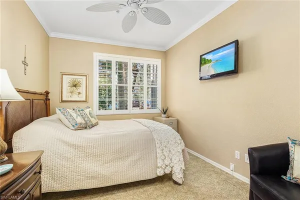 a bedroom with a bed and dresser