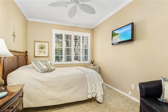 a bedroom with a bed and dresser