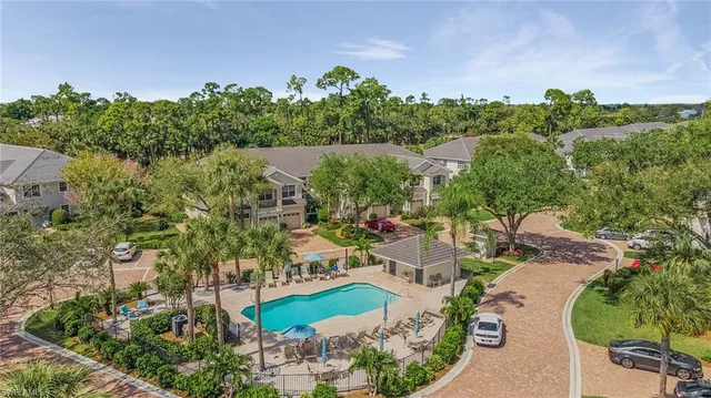 an aerial view of a house with yard