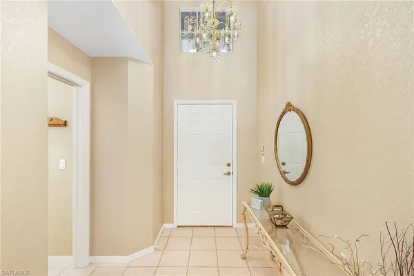 a view of a room with painted walls and a window