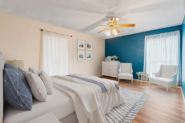 a bedroom with a bed and a couch