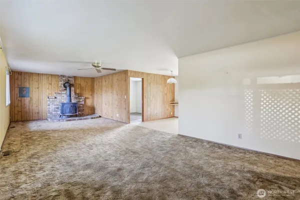 a view of a sink and a refrigerator in a room