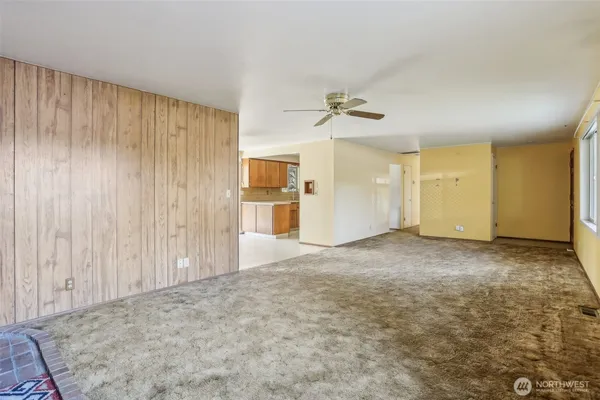 a view of a livingroom with a bathroom and a shower