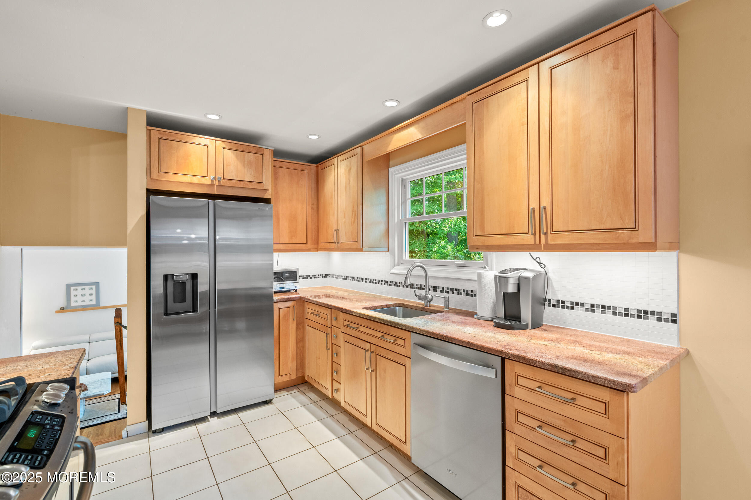 4 Hamilton Hill Road Lincroft, NJ 07738 - Photo 11 of 44 a kitchen with stainless steel appliances granite countertop a sink a stove and a refrigerator