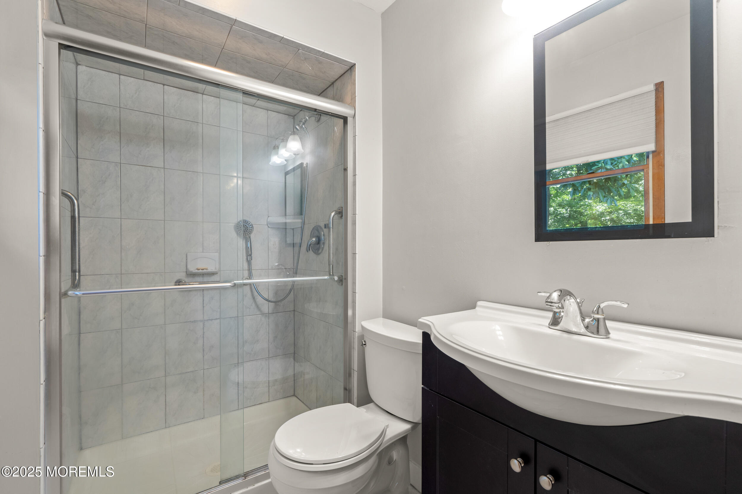4 Hamilton Hill Road Lincroft, NJ 07738 - Photo 31 of 44 a bathroom with a sink a toilet and shower