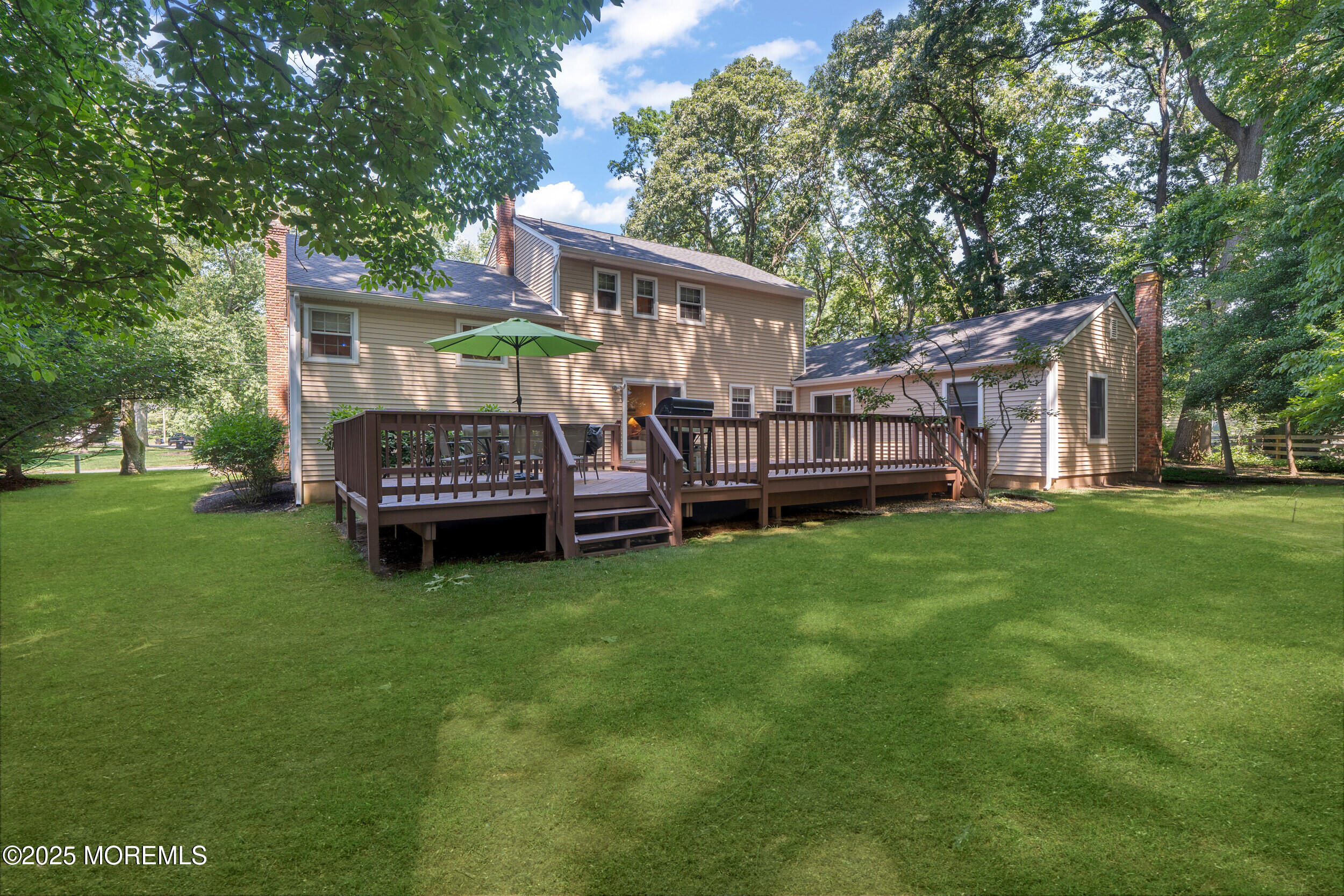 4 Hamilton Hill Road Lincroft, NJ 07738 - Photo 37 of 44 a view of backyard with deck and garden