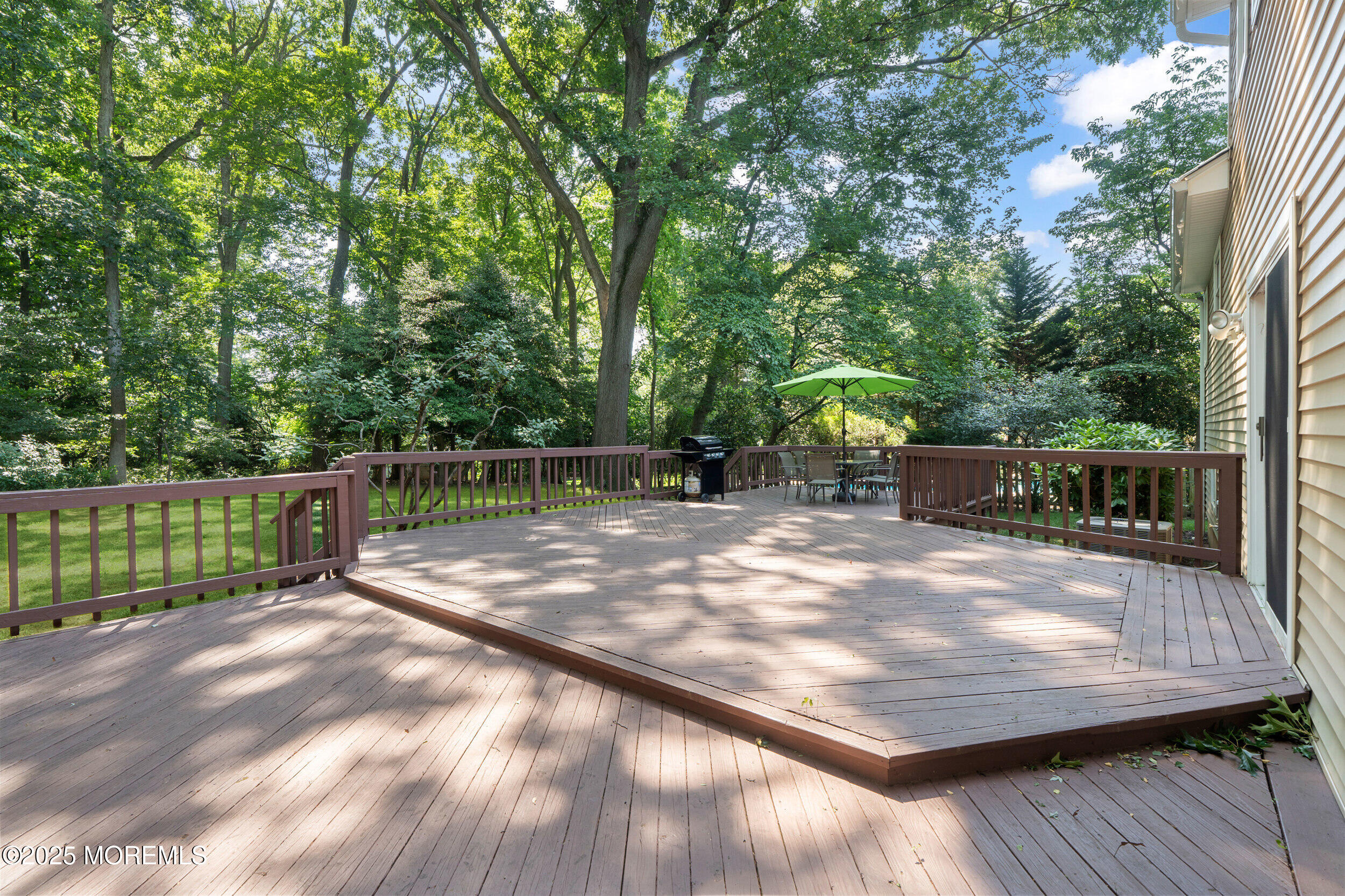 4 Hamilton Hill Road Lincroft, NJ 07738 - Photo 38 of 44 a view of a backyard with wooden fence