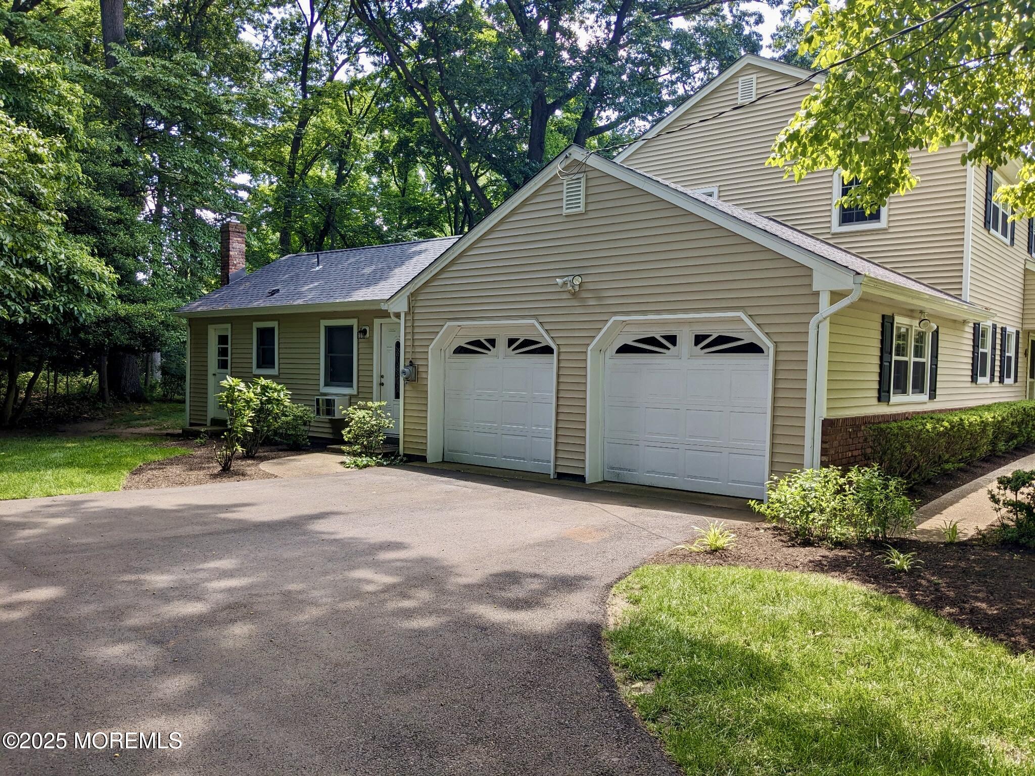 4 Hamilton Hill Road Lincroft, NJ 07738 - Photo 41 of 44 a view of a house with a yard and potted plants