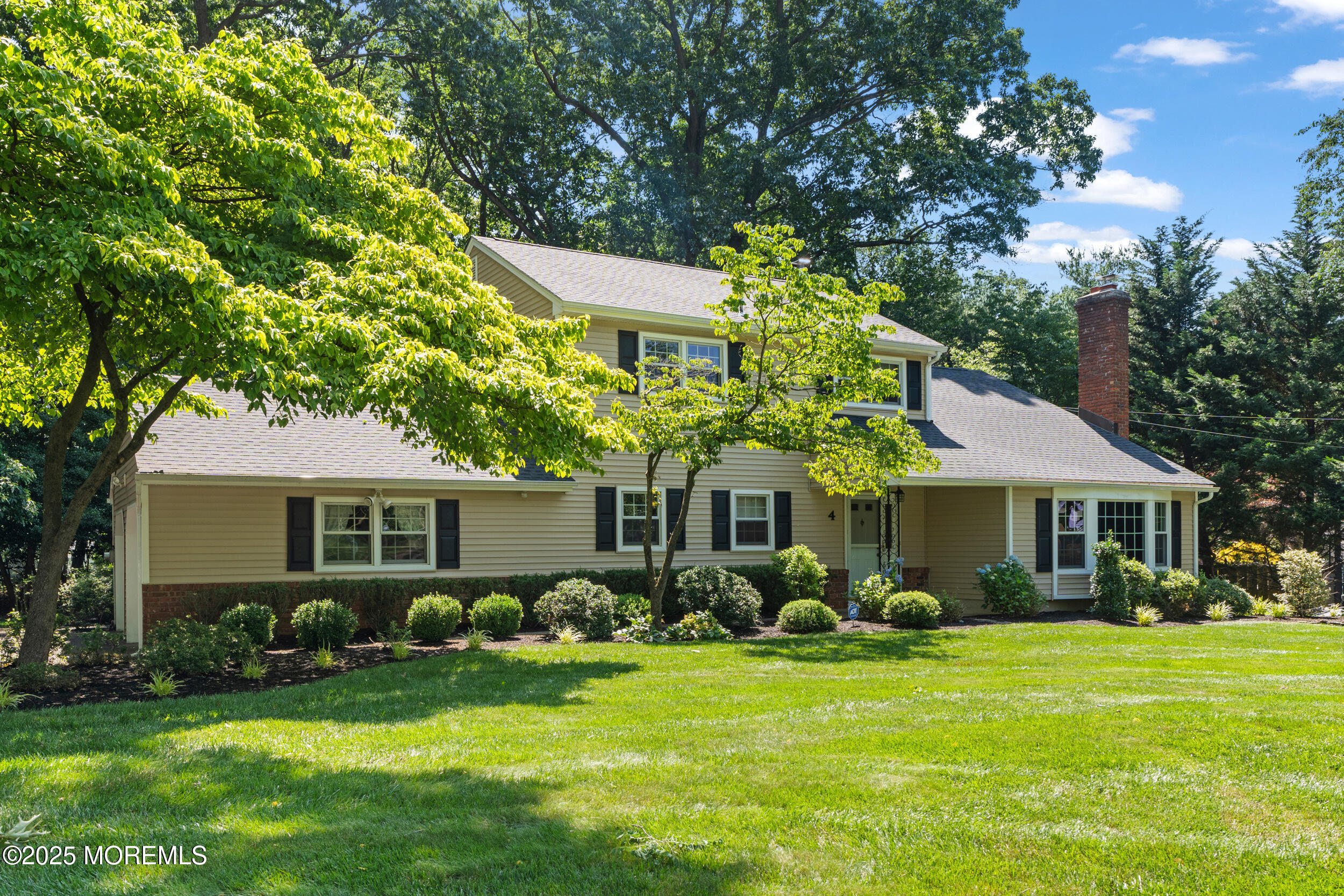 4 Hamilton Hill Road Lincroft, NJ 07738 - Photo 43 of 44 a front view of a house with a garden
