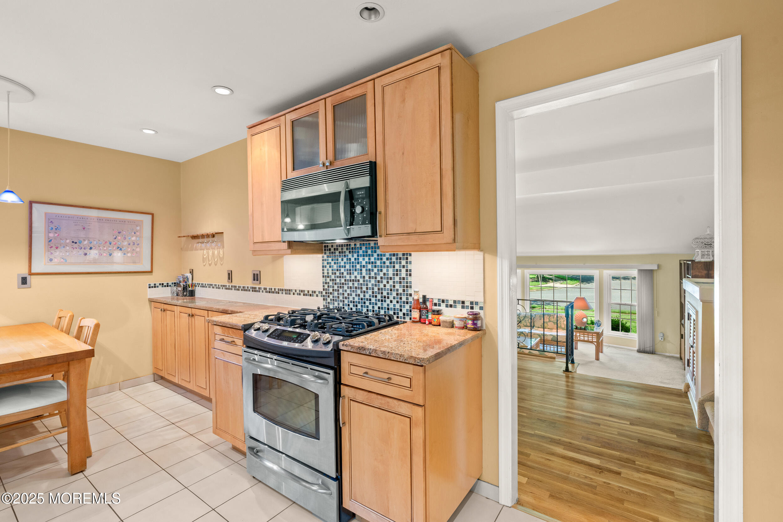 4 Hamilton Hill Road Lincroft, NJ 07738 - Photo 10 of 44 a kitchen with stainless steel appliances granite countertop a stove a sink and a microwave