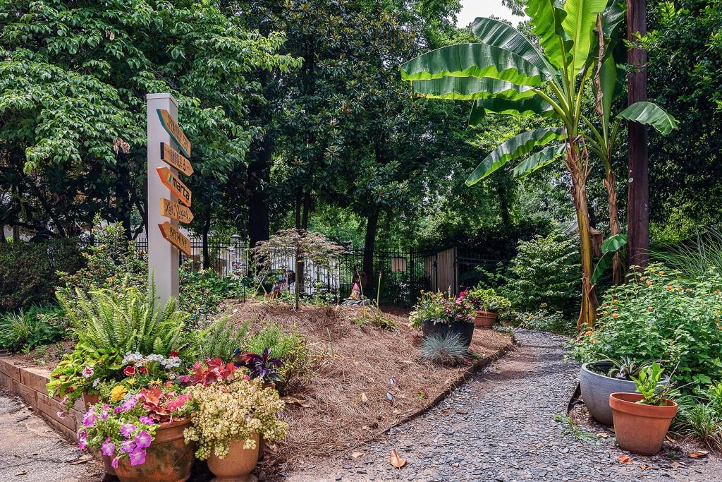148 Waverly Way Northeast, Unit 6 Atlanta, GA 30307 - Photo 18 of 32 a view of a garden with flowers and trees