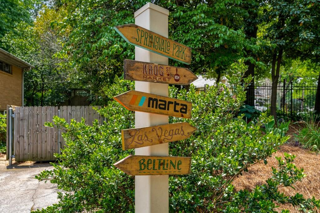 148 Waverly Way Northeast, Unit 6 Atlanta, GA 30307 - Photo 20 of 32 a front view of a house with a yard and tree s