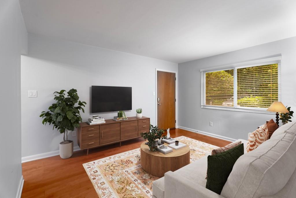 148 Waverly Way Northeast, Unit 6 Atlanta, GA 30307 - Photo 2 of 32 a living room with furniture and a flat screen tv
